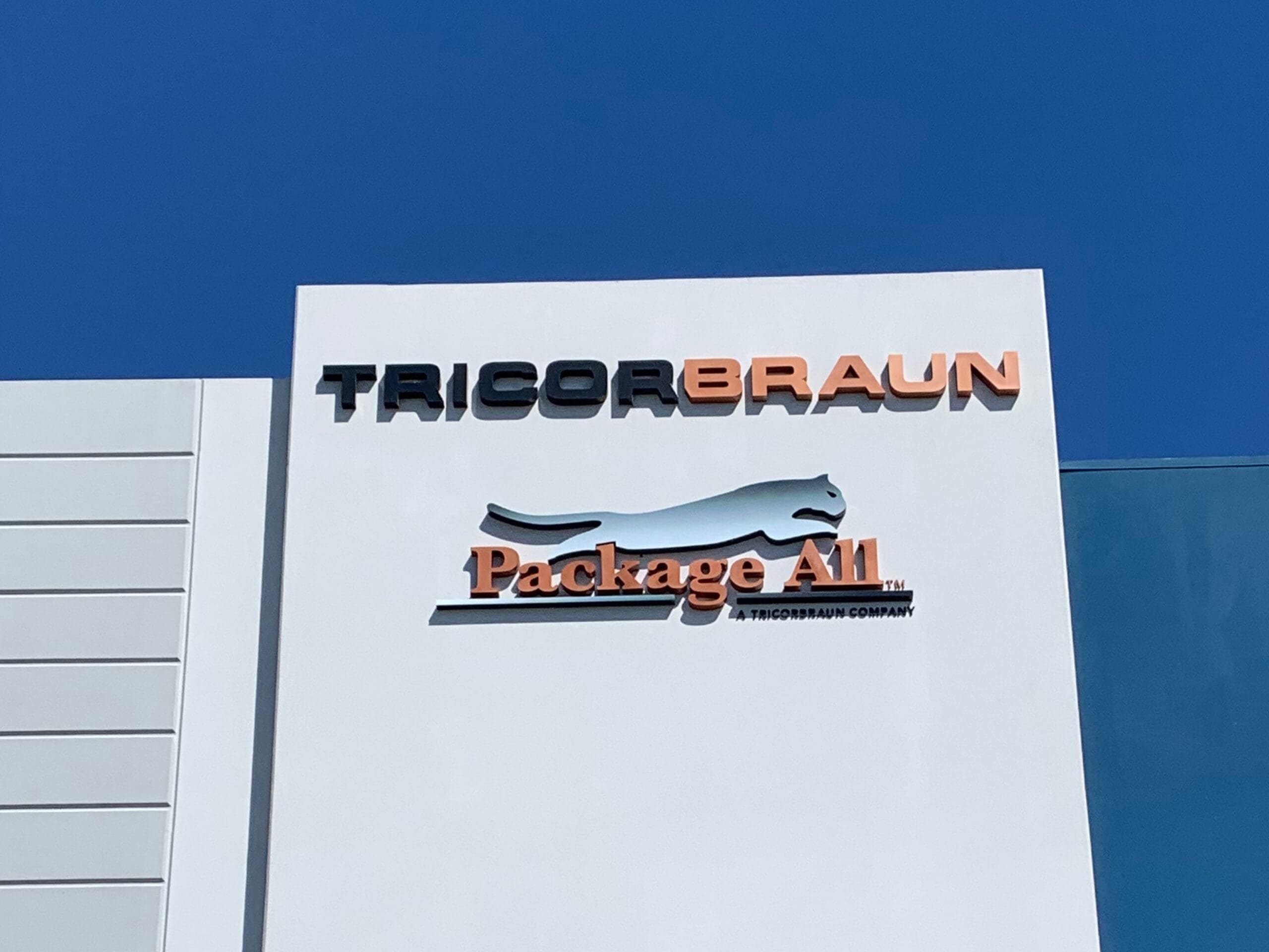 Custom signs displayed at a local and national business, emphasizing their power to attract customers and boost visibility.